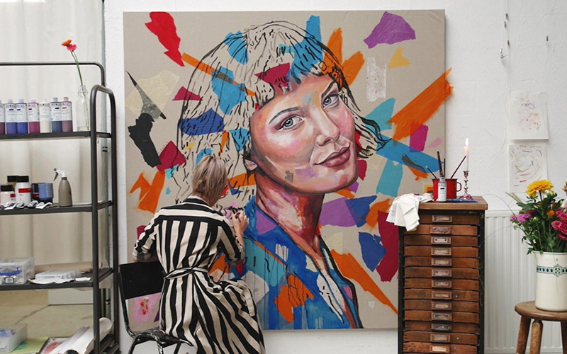 Artist Nicky Myny working on a painting